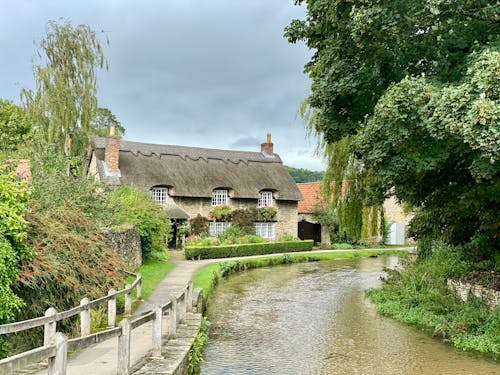 A House With a Chimney Near a Body of Water