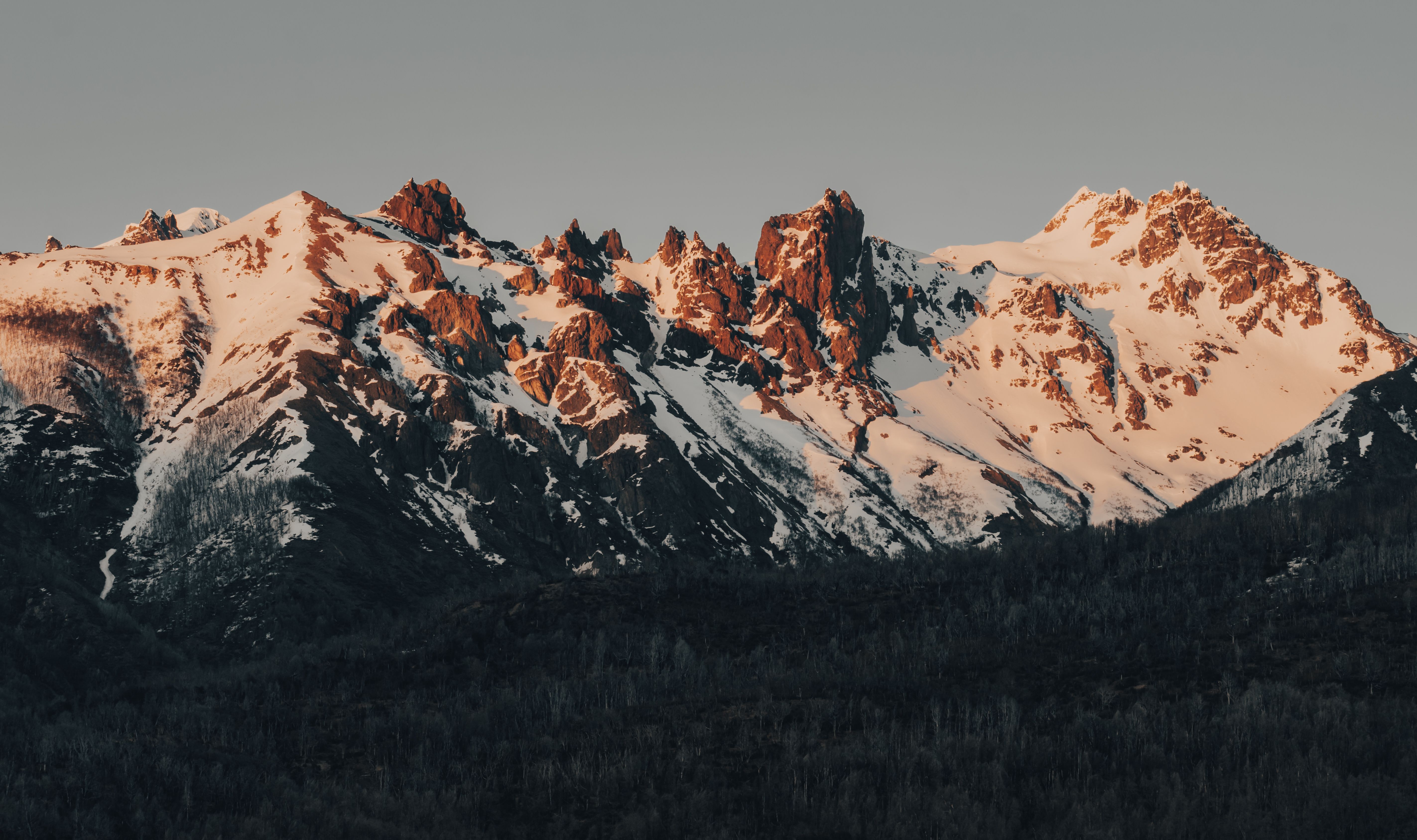 Snow Capped Mountains During Golden Hour · Free Stock Photo