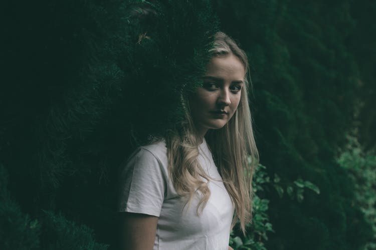 A Woman In White Shirt Sneaking