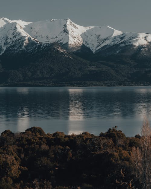 Free A Snow Covered Mountain and a Lake  Stock Photo