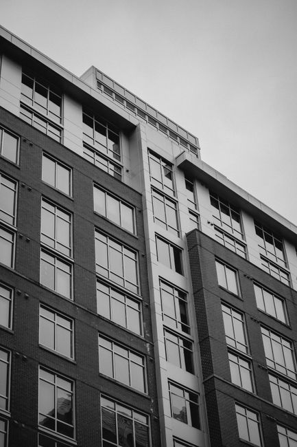 Monochrome image of a contemporary high-rise building exterior in Reston, Virginia.