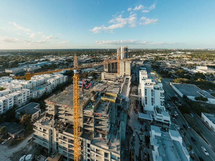 Unfinished Building And Tower Crane At Construction Site In City