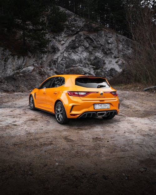 Parked Yellow Car on Dirt Ground 