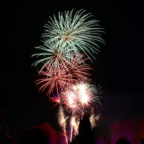 Photography of Green and Red Fire Works Display