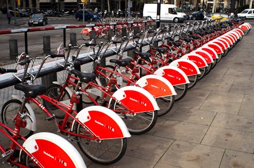 Parked Red and White Bicycles