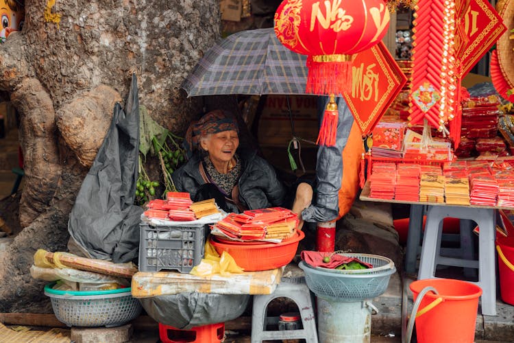 A Happy Woman Selling Chinese New Year Decorations