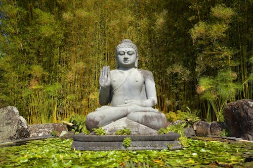 A Buddha Statue Displayed on a Pond at Crystal Castle and Shambala Gardens in Montecollum, Australia