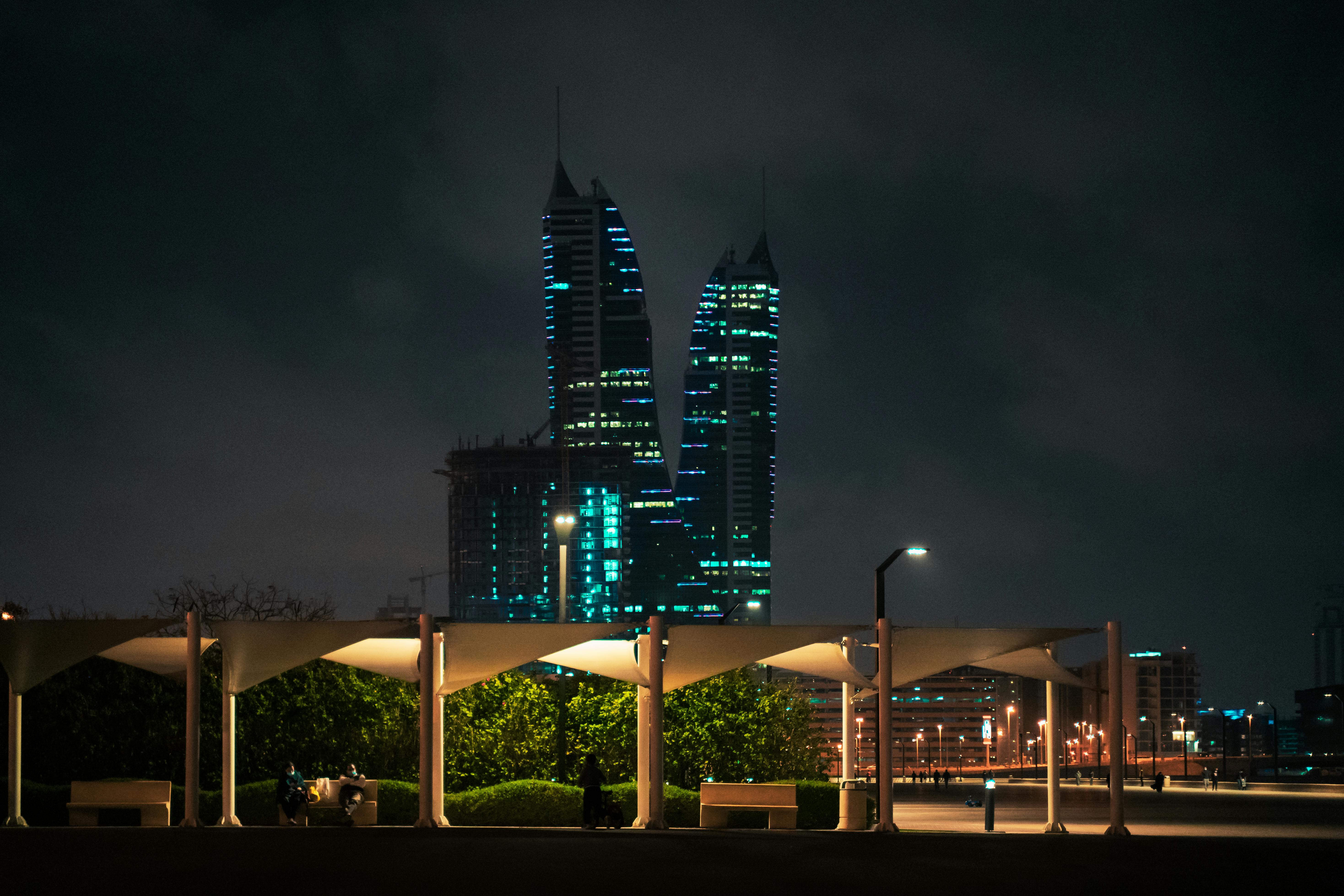 Stunning night view of Bahrain's skyline with illuminated modern towers and cityscape.