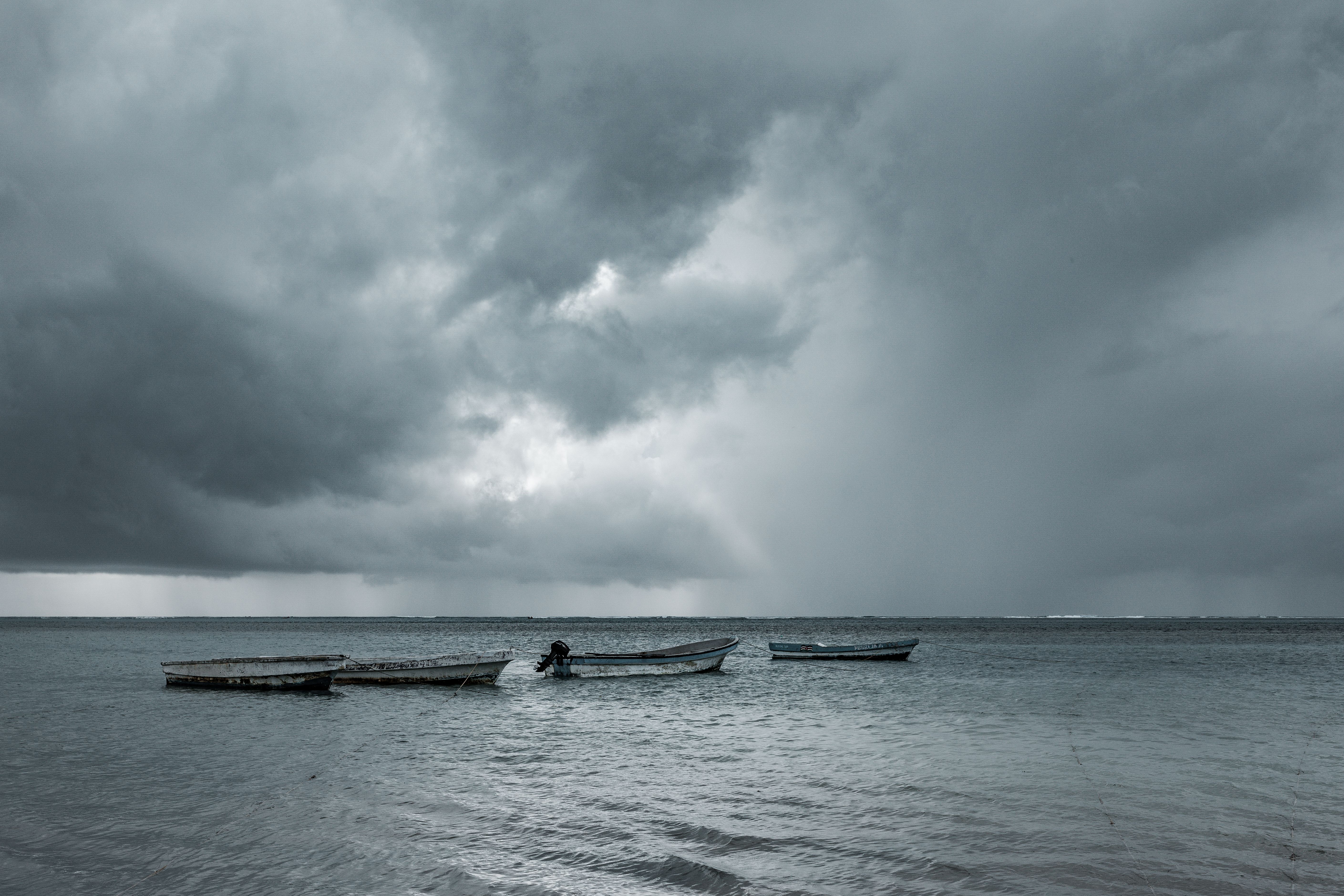 Wooden Boats Under Cloudy Sky · Free Stock Photo