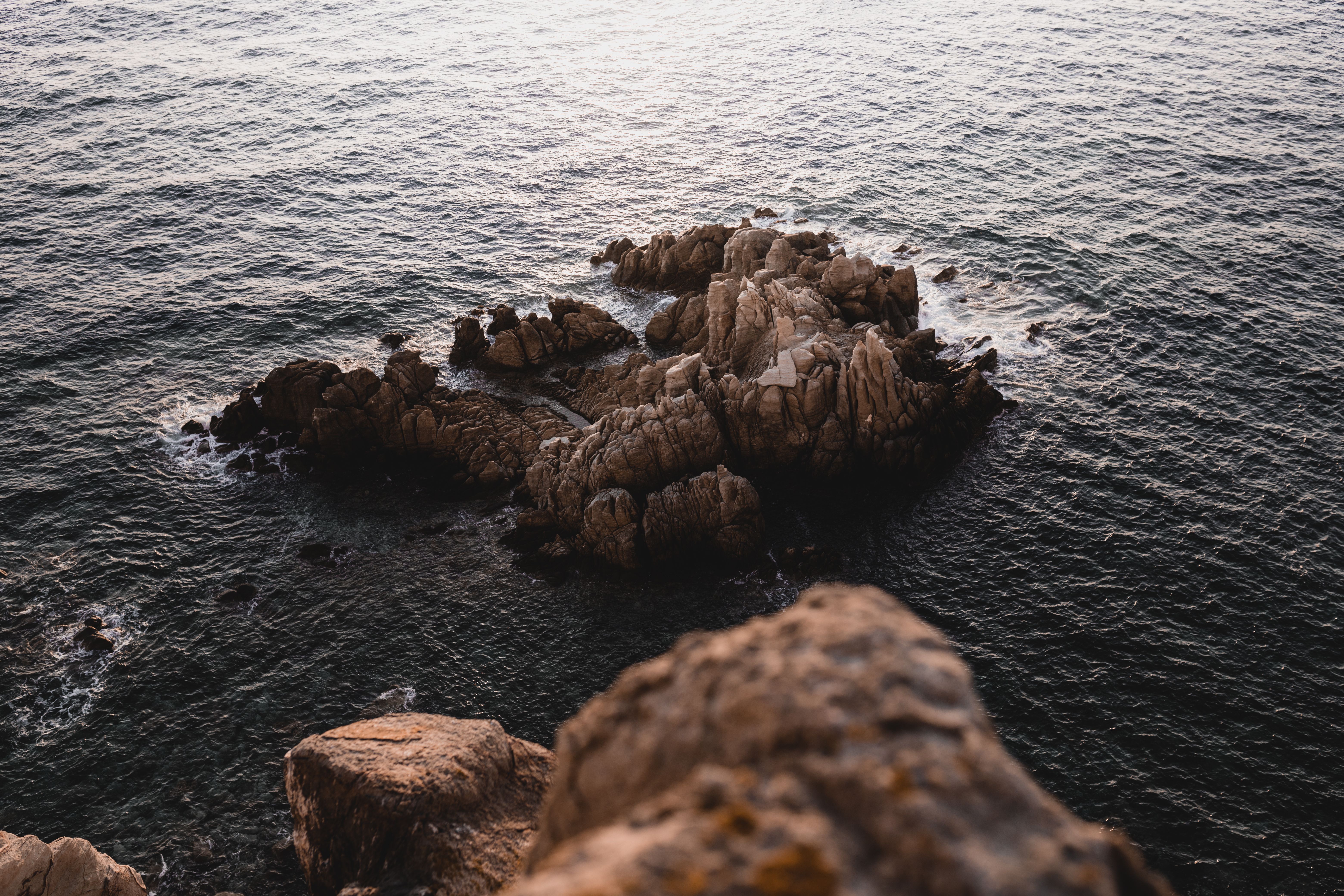 Brown Rock Formation on the Sea · Free Stock Photo