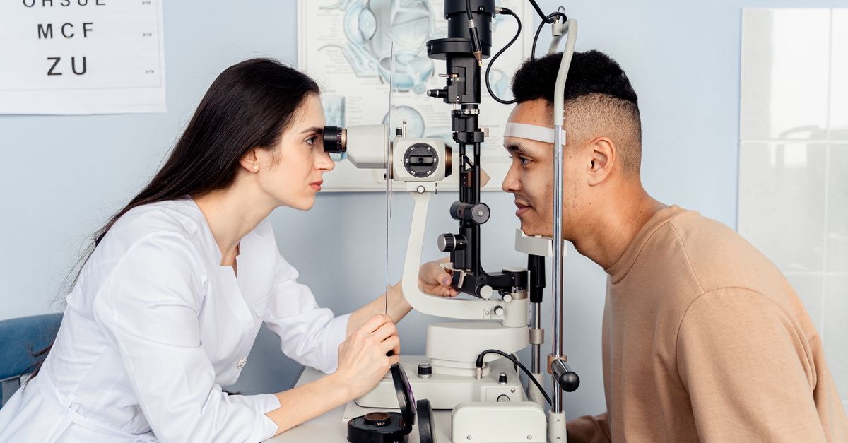 Ophthalmologist performing a comprehensive eye examination on a patient in a modern eye clinic