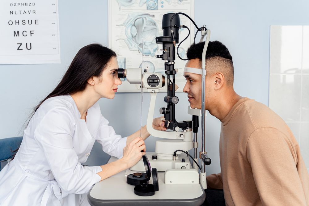 Friendly optometrist welcoming a patient inside the bright Focalpoint Vision Studio clinic
