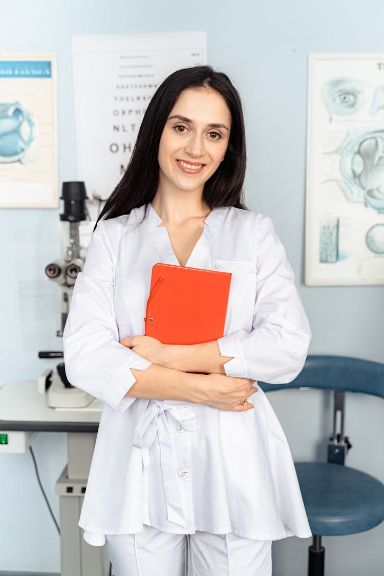 An Optometrist Holding A Notebook 