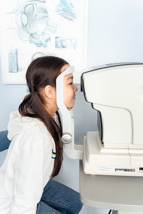 A Girl Having an Eye Examination