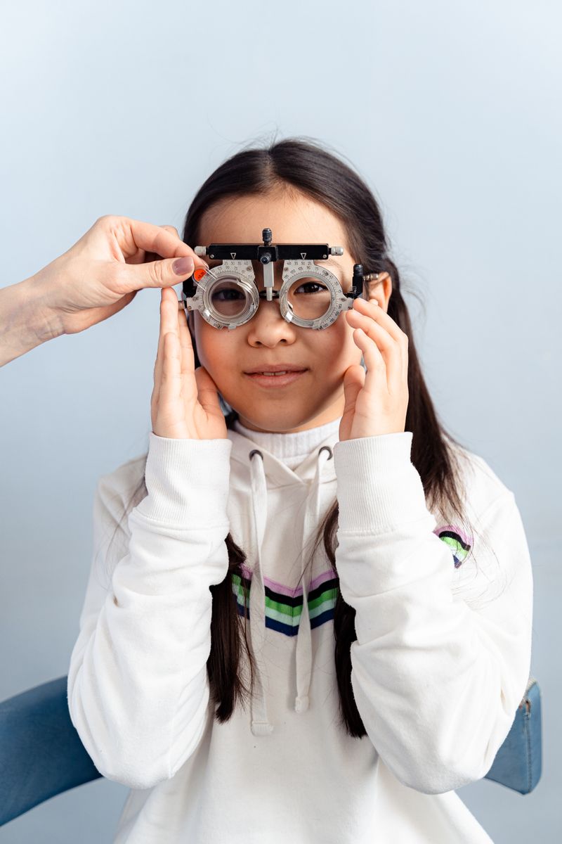 Young girl wearing a trial frame during an eye test