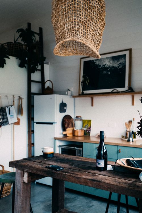Free Warm and charming rustic kitchen with wooden accents and modern decor. Stock Photo