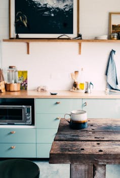 A rustic kitchen setting with a wooden table and coffee mug, exuding warmth and coziness.