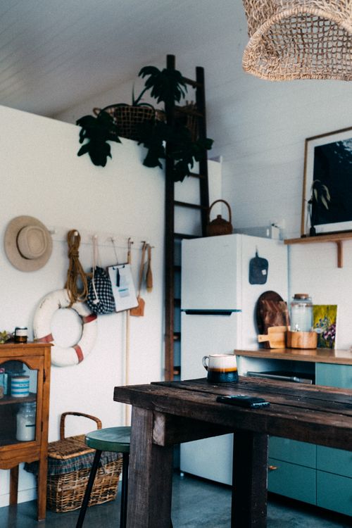Free A rustic kitchen with wooden accents and vintage decor, creating a warm and inviting atmosphere. Stock Photo