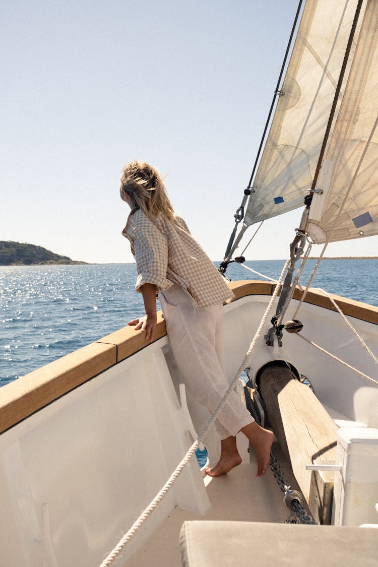 Back View Of A Woman Standing On A Boat