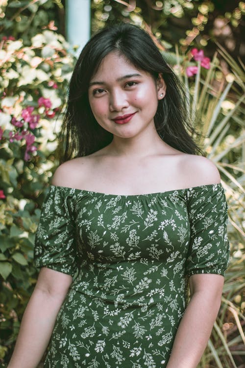 Woman in Green Off Shoulder Dress Smiling