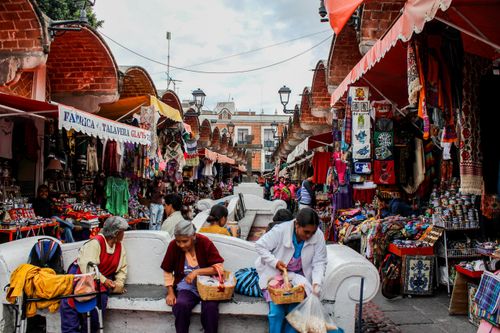 Free Vibrant street market in Puebla, Mexico featuring local vendors selling handcrafted goods. Stock Photo