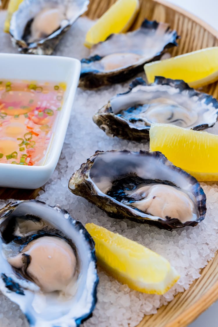 Oysters On A Wooden Plate