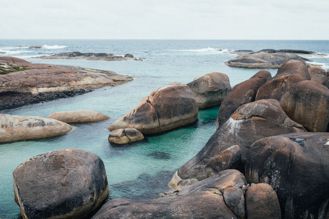 Seascape Rocks Brown Brown Rock Formations on Sea Under the Sky · Free Stock Photo