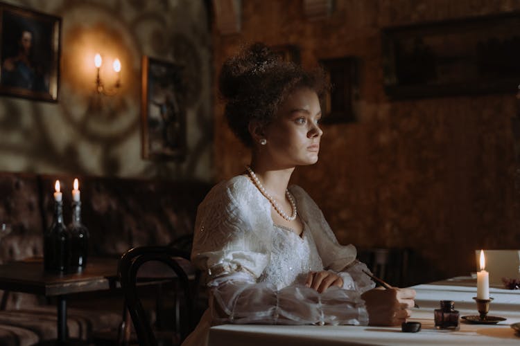 Pensive Royal Lady Sitting Beside The Table 