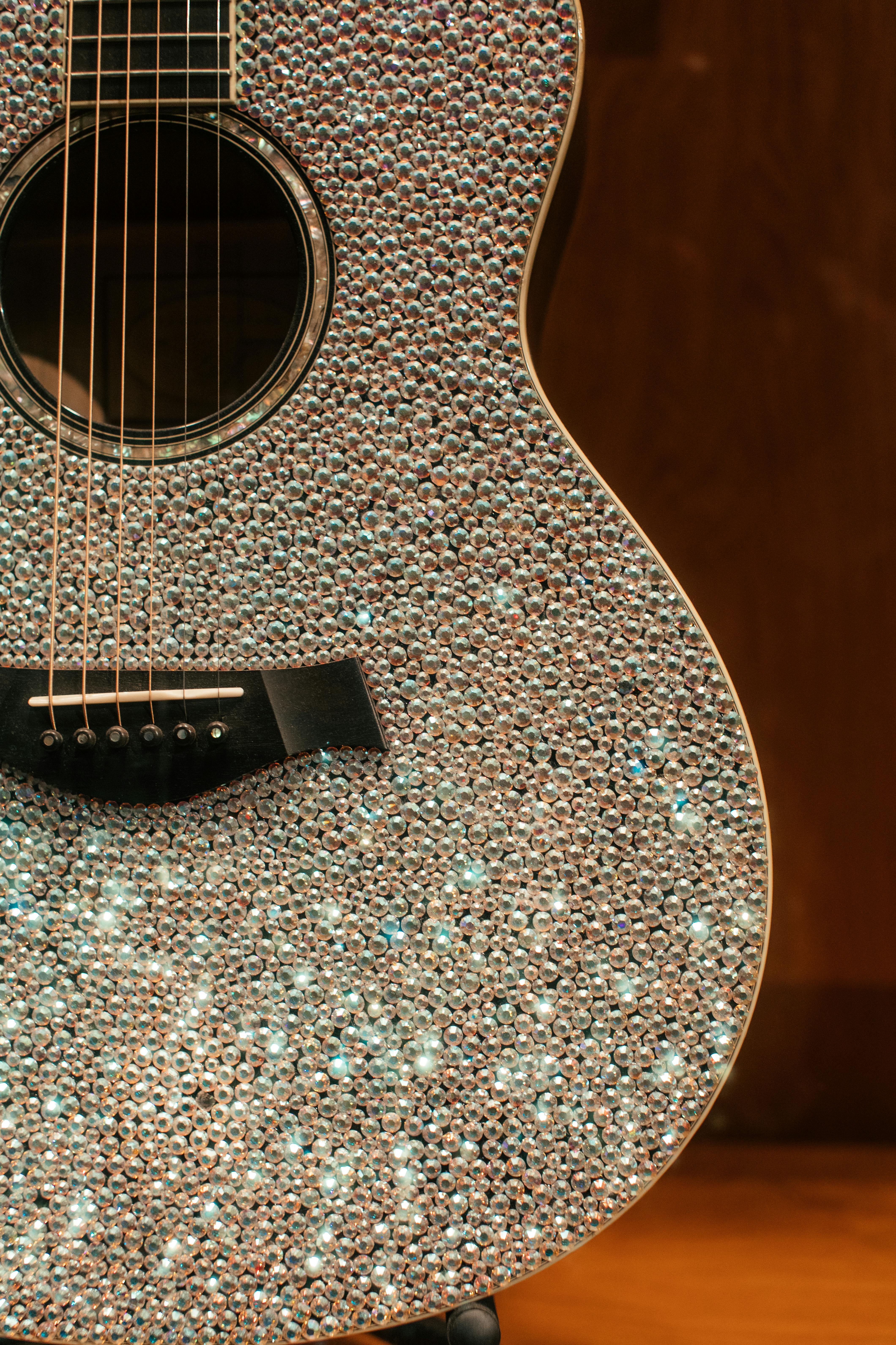close up photo of decorated accoustic guitar