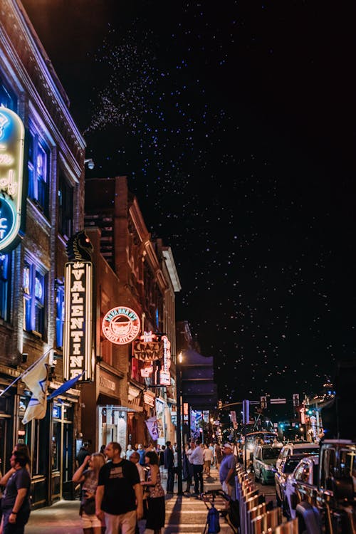 Busy People Walking on Street during Night Time