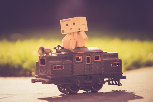 Free Danboard on Top of Toy Train Stock Photo