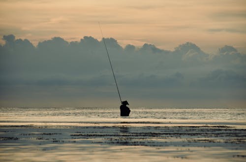 Person Fishing on Sea