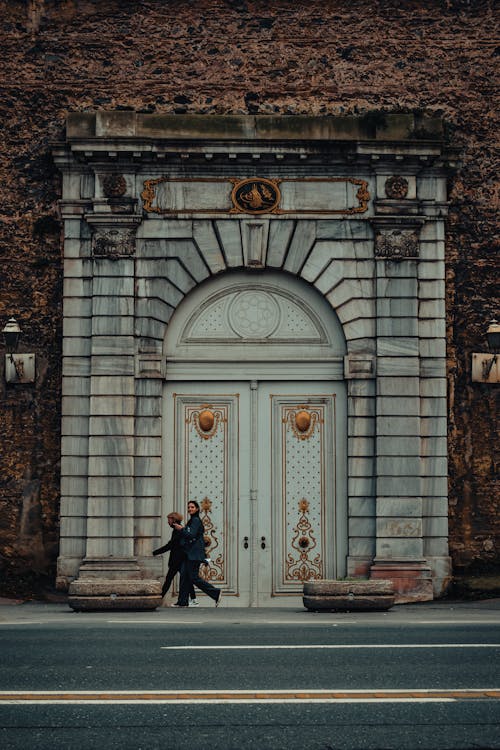 People Walking Near the Big Door of an% Establishment