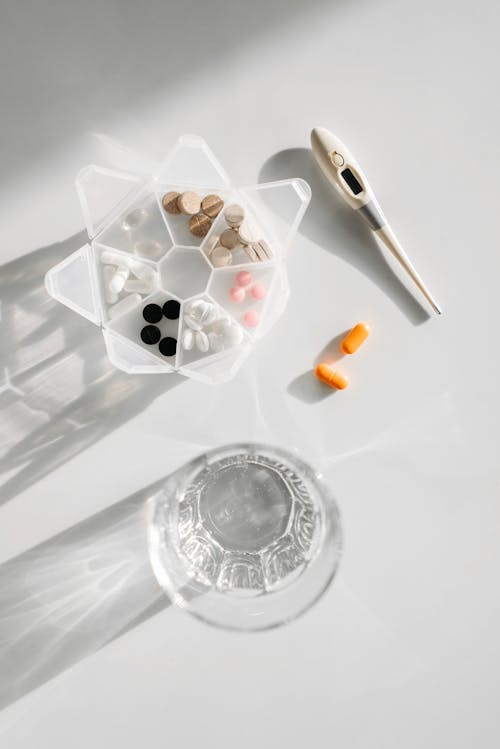 Medicines Beside A Glass Of Water