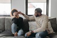 A Man Touching a Woman's Forehead