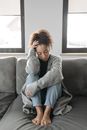 Woman Sitting On A Sofa