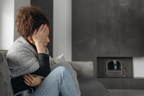 Woman Touching Her Head