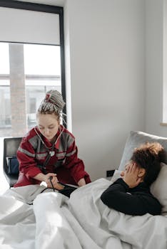 Paramedic providing healthcare assistance to a sick woman in a bright room.