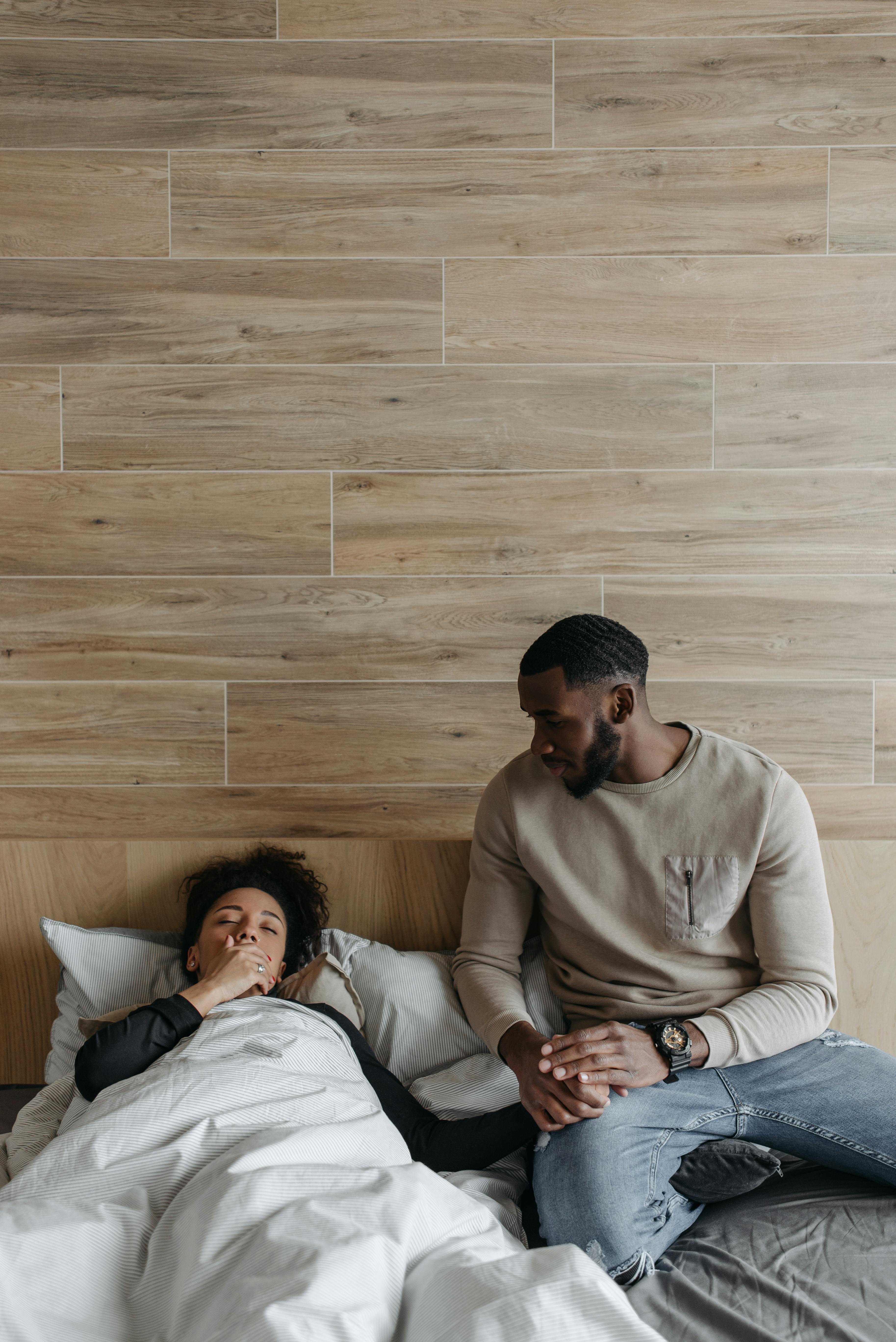 man holding sick woman s hand