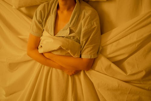 Free A Person Lying on the Bed with Blanket Stock Photo