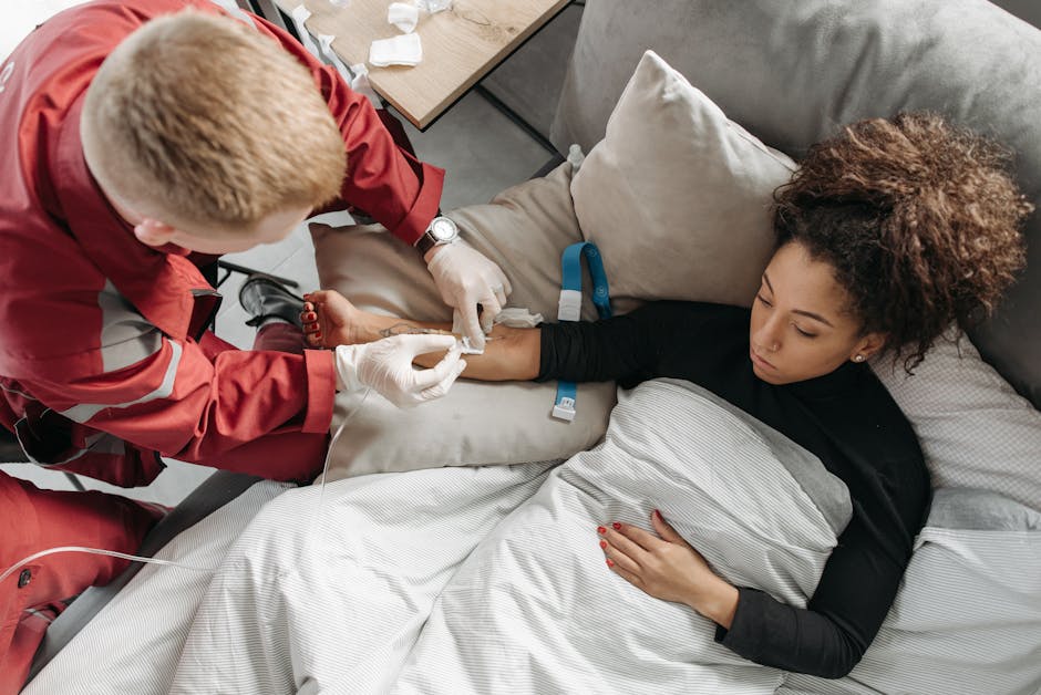 Nurse teaching a caregiver proper wound dressing technique in a home setting - Wound care delivered to home