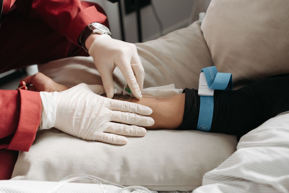 ER-trained nurse administering IV therapy