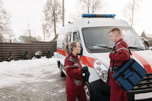 People Standing Near An Ambulance