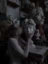 Living sculpture in workshop with bust