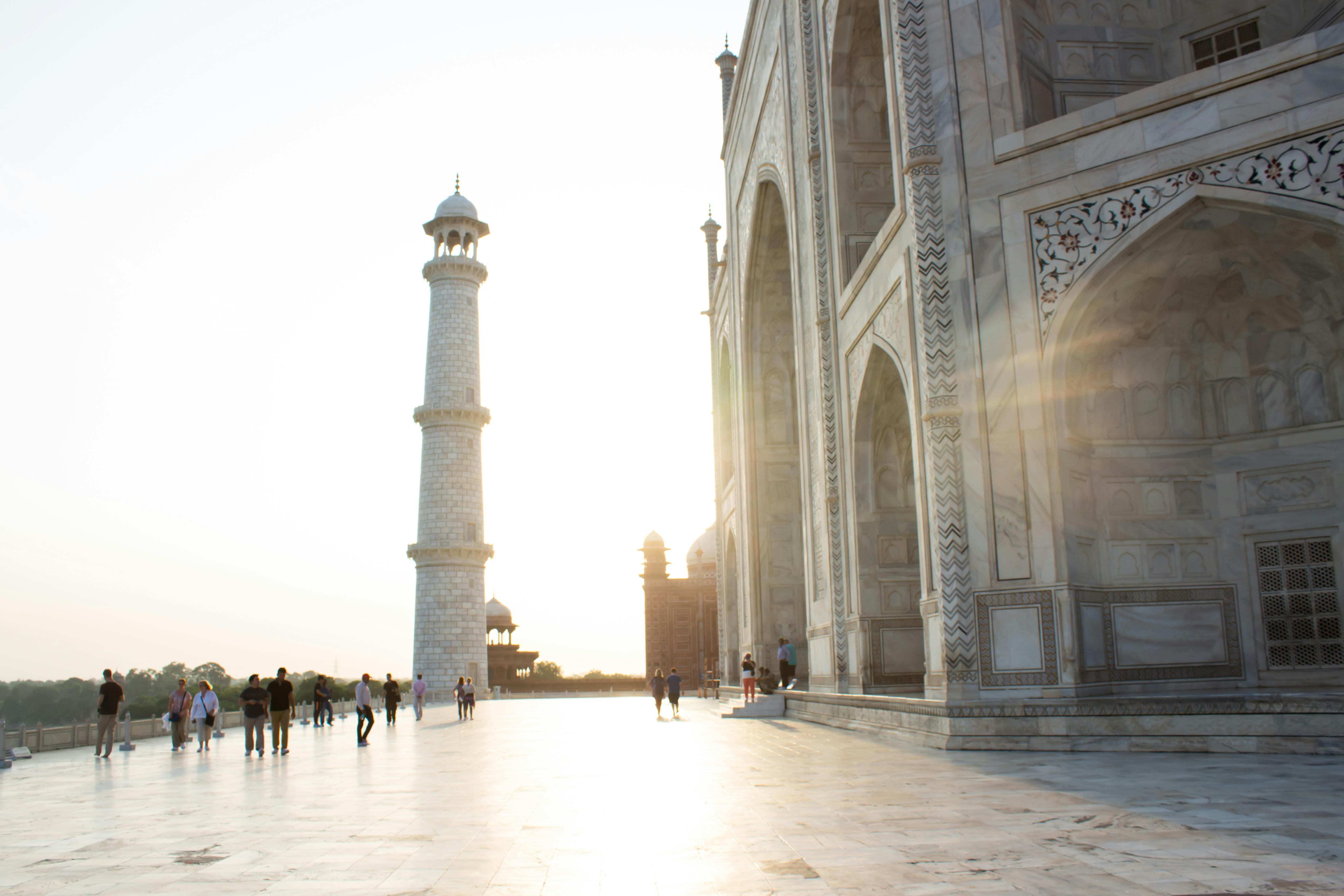 Beautiful sunrise at the iconic Taj Mahal with its majestic minaret in Agra, India.