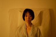 Woman in White and Gray Pinstripe Button Up Shirt