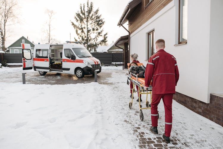 Man Pushing A Stretcher 