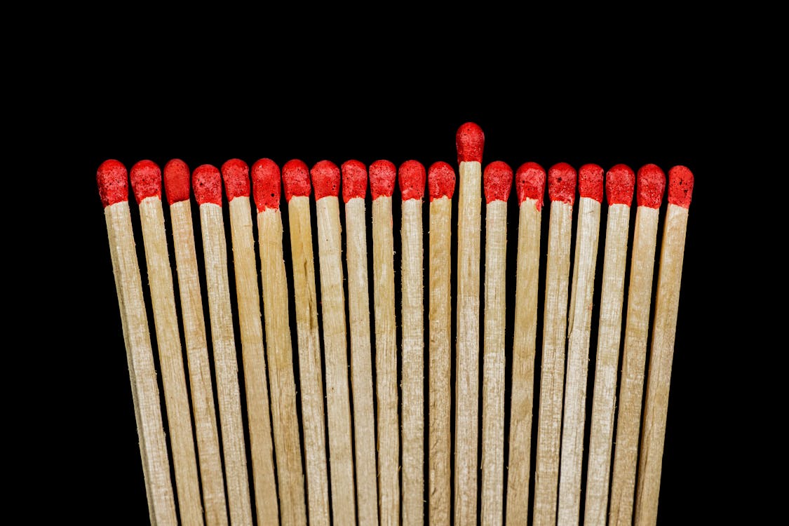 Brown and Red Matches Sticks Near Each Other