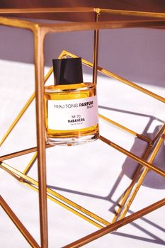 A Perfume on the Golden Steel Abstract Stand 