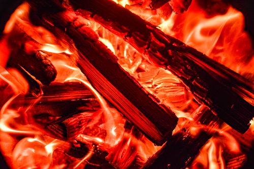 Free A vivid close-up of burning wood showcasing intense flames and warmth. Stock Photo